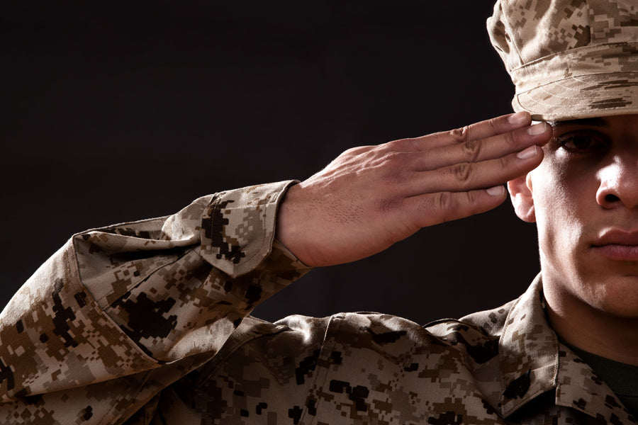 US Marine Saluting on Black Background