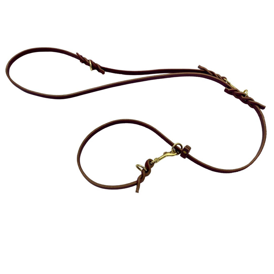 Image displaying the Burgundy and Black Ravenox Multifunctional Leather Dog Leashes, both with solid brass hardware, showcasing the superior craftsmanship of Amish methods such as hand cutting, edging, and finishing, designed for longevity and a variety of uses, from a simple walk to complex training scenarios. (7838529061101)