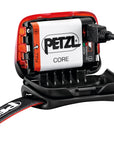 Close-up of the PETZL ACTIK® CORE headlamp showing its multi-beam design, single button for easy use, and red lighting mode for preserving night vision. (8759324639469)