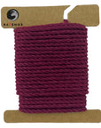 Deep Burgundy Ravenox Three Strand Twisted Cotton Cord, offered in 1/8-inch and 3/16-inch gauges, wound on a cardboard disk, showcasing the cord's sophisticated color. (3847001409)