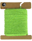 Fresh Lime Green Ravenox Three Strand Twisted Cotton Cord in 1/8-inch and 3/16-inch thicknesses, looped on a cardboard disk, displaying the cord's vibrant, energetic color. (3869011457)