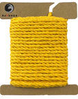 Golden Ravenox Three Strand Twisted Cotton Cord, presented in 1/8-inch and 3/16-inch thicknesses on a cardboard disk, highlighting the cord's luxurious, shimmering hue. (3868135169)