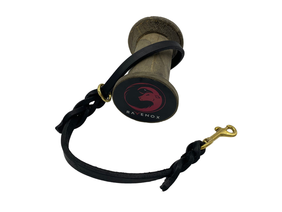 18-inch black braided leather dog leash swatch. Crafted from high-quality latigo leather, this short traffic lead is hand-finished by Amish artisans. Ideal for training, vet visits, and ensuring safety in crowded areas. Designed by Canine Education expert, Mary Cortani, with proceeds supporting Operation Freedom Paws. (7765017264365)