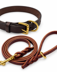 One brown leather dog collar and one burgundy 1/2-inch by 6-foot leash. Representative Large collar pictured; collar width and hardware details vary by selected size.
