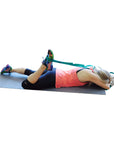 Ravenox Yoga Strap for Stretching and Flexibility in Green Being Used by Fitness Woman Laying Facedown on Yoga Mat (683212609)