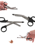 2 pairs of Ravenox EMT Scissors with black handles and a penny that was cut by the scissors. (4297616705)