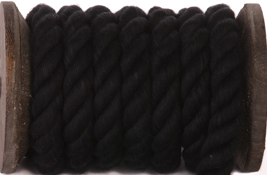 Robust Three Strand Twisted Polyester Rope in Black by Ravenox, wound on a wooden spool, illustrating the rope's strength and sleek appearance. (1688301863002)