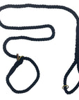 Image of Ravenox Handmade Cotton Slip Lead Dog Leash in Black. The leash features a sleek, black cotton rope design, providing both strength and flexibility. It includes an adjustable loop handle and a slip knot for secure and comfortable handling. The craftsmanship showcases a smooth, tightly woven structure, suitable for dogs of various sizes. The leash's elegant simplicity and functionality are evident, making it a stylish and practical choice for dog owners. (1778149359706)