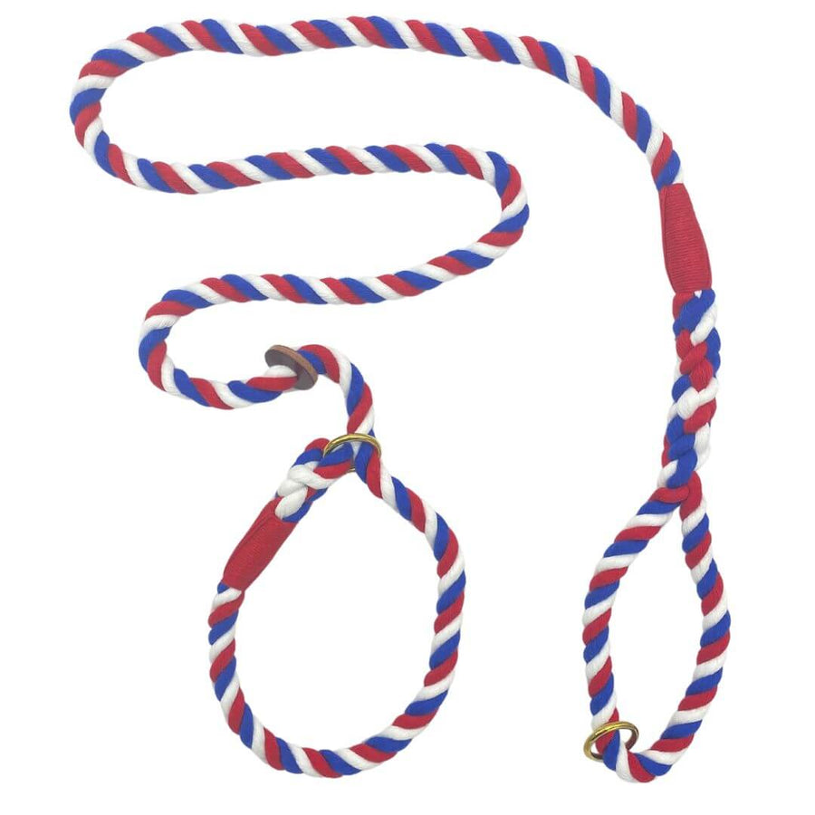 Image showcasing the Ravenox Handmade Cotton Slip Lead Dog Leash in a patriotic Red, White & Blue color scheme. This leash features a striking combination of red, white, and blue hues, woven together in a durable cotton rope. The design symbolizes a blend of elegance and national pride. It includes a comfortable loop handle and an adjustable slip knot, suitable for dogs of various sizes. The high-quality craftsmanship ensures both style and functionality for everyday dog walks. (1778149359706)