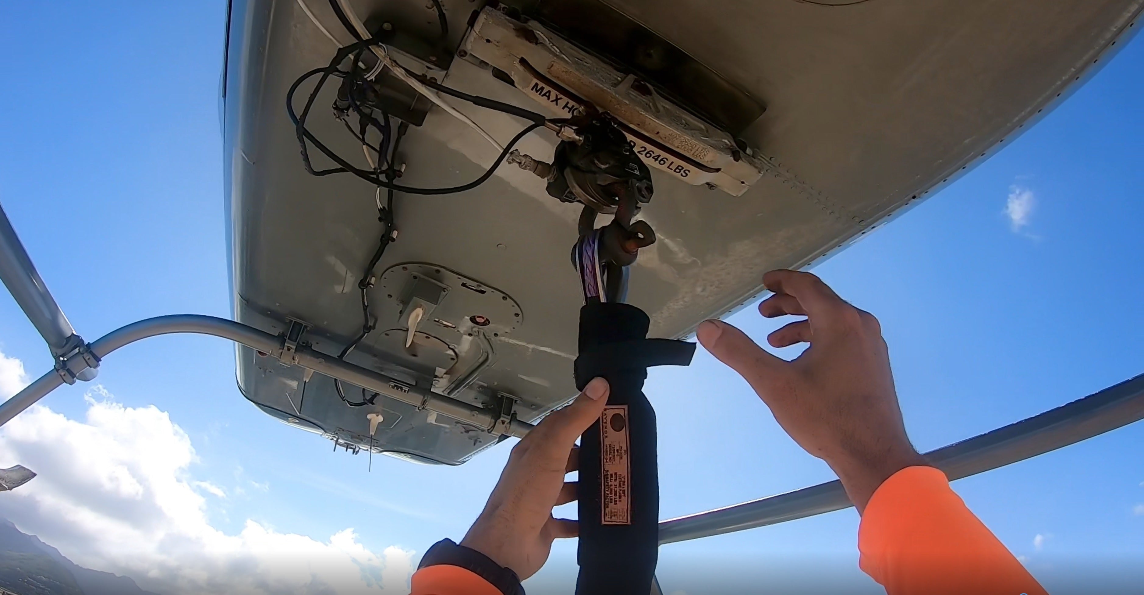 A helicopter, using Ravenox Synthetic Helicopter Longlines, hoists a jacuzzi onto the rooftop of a high-rise condominium in Hawaii. The longlines, made from ultra-strong and lightweight HMPE fiber, demonstrate their low-stretch and high-strength capabilities in this demanding lifting operation. The scene captures the practical use of these longlines, highlighting their durability and safety features essential for heavy-lift helicopter operations. (7552156795117)