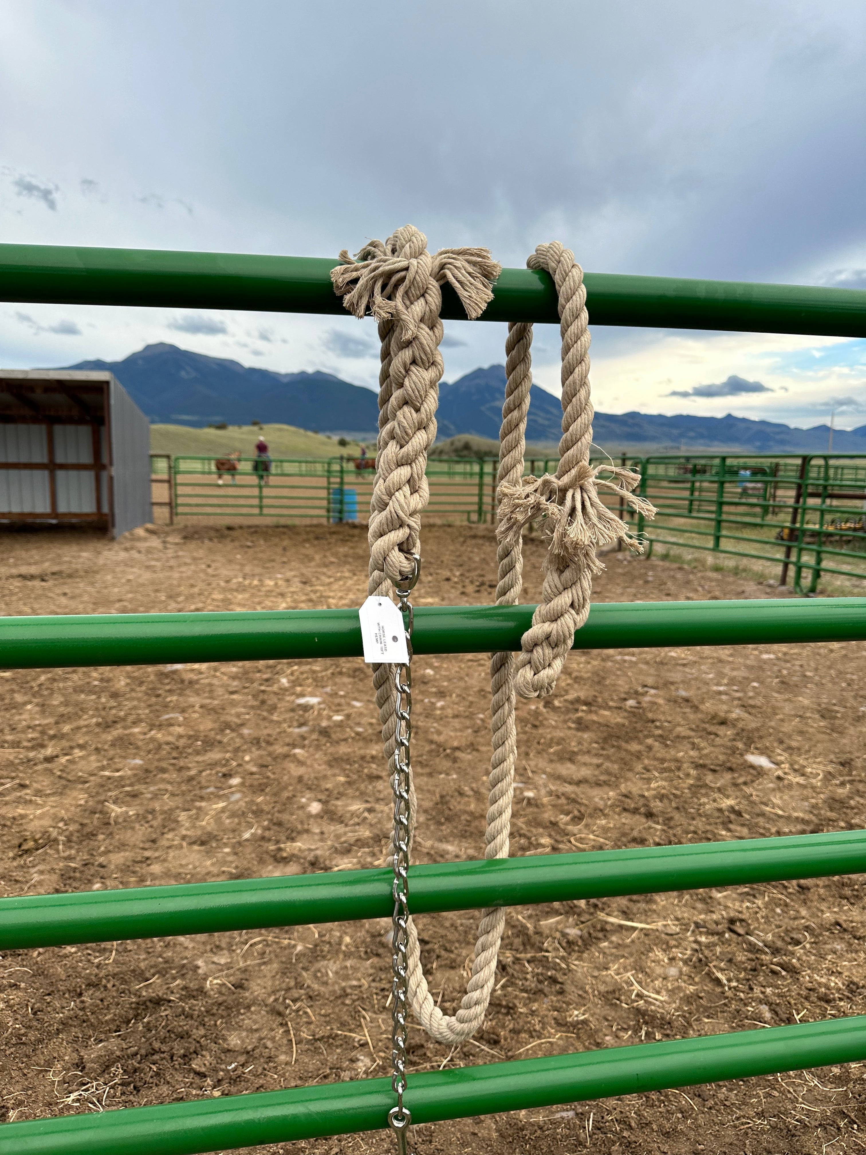 1-inch hemp horse lead with chain draped over a fence, set against the picturesque backdrop of a Montana horse ranch. (8213506883821)