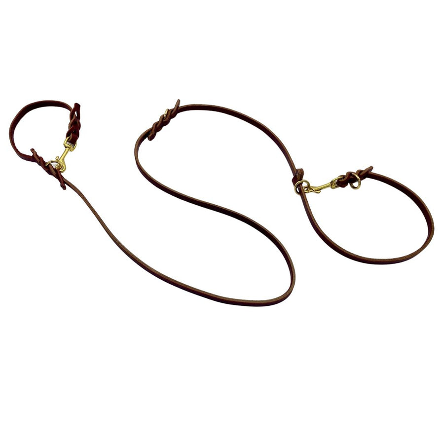 Image of the Burgundy Ravenox Multifunctional Leather Dog Leash with solid brass hardware, an all-encompassing lead that serves as a long, traffic, hands-free, slip lead, short leash, long tether, control leash, and two-dog leash, ideal for veterinarians, trainers, and K-9 units seeking enhanced control and versatility in a single high-quality leash. (7838529061101)