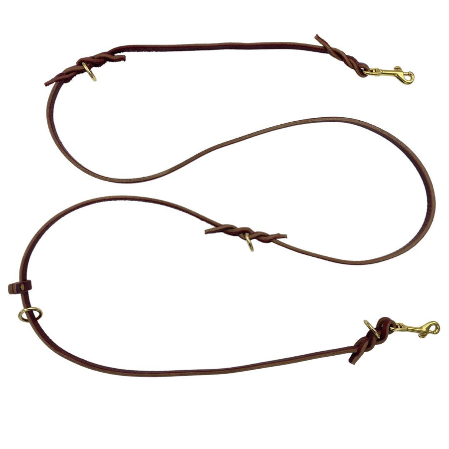 Image displaying the Burgundy and Black Ravenox Multifunctional Leather Dog Leashes, each with solid brass hardware, handcrafted using traditional Amish methods for superior quality, featuring hand cutting, edging, and finishing, designed for longevity and multifunctional use, from a family-run leather shop heritage. (7838529061101)