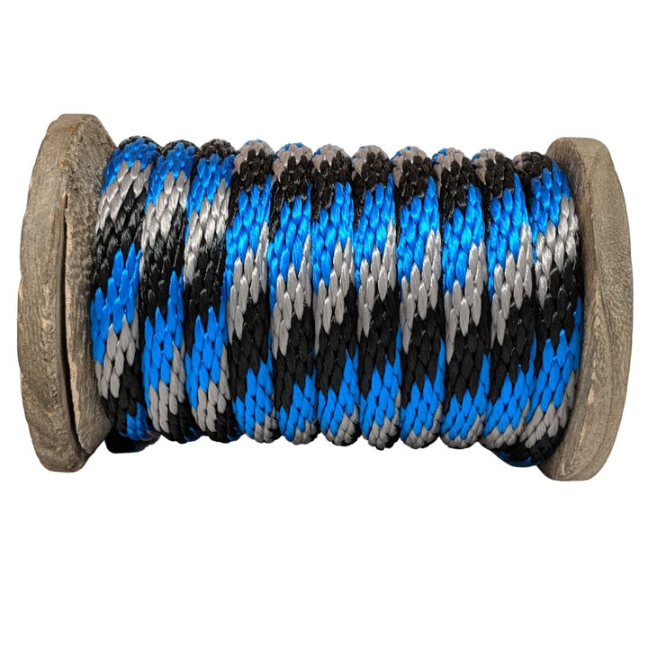 Close-up of a Ravenox black, blue, and silver solid braid polypropylene derby rope wrapped on a wooden spool. (8217643090157)