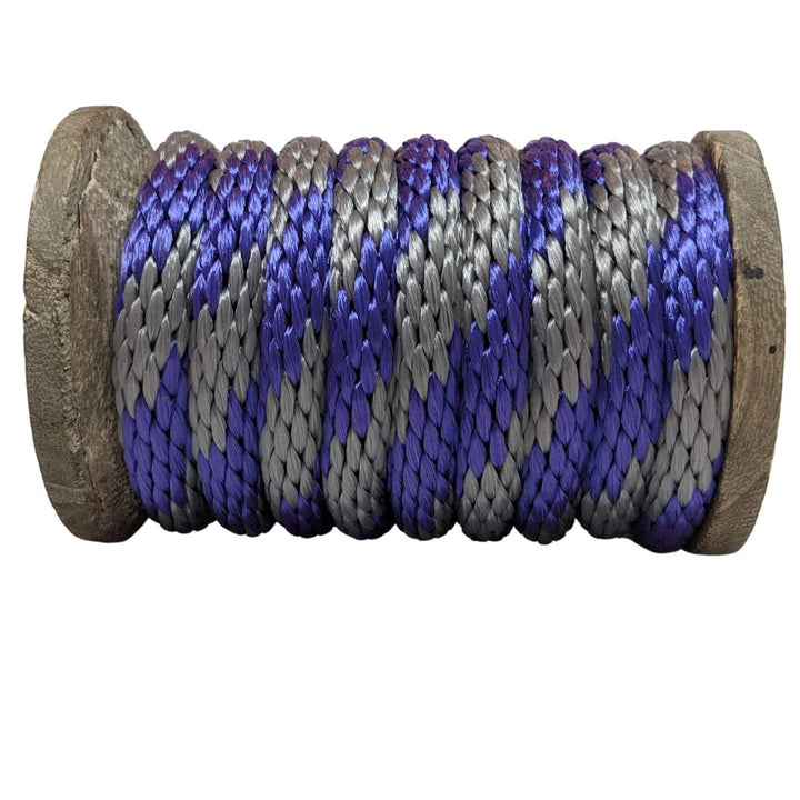 Close-up of a Ravenox purple and silver solid braid polypropylene derby rope wrapped neatly on a wooden spool. (8217685754093)