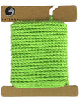 Bright and zesty Lime Green Ravenox Macrame Cord in a three-strand 2mm & 3mm design, shown on a cardboard disk, presenting the cord's lively color. (7472676700397)