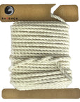 Swatch of Ravenox Natural White 100% Cotton Cord in 1/8-inch and 3/16-inch three-strand twist, coiled on a cardboard disk, showcasing its organic purity. (3712668161)