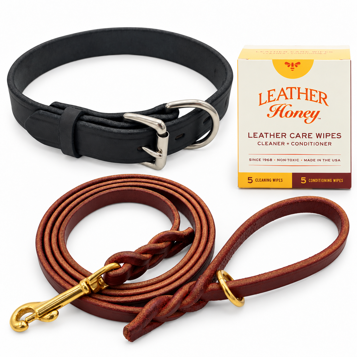 One black leather dog collar and one burgundy 1/2-inch by 6-foot leash, plus one Leather Honey box containing 5 cleaning and 5 conditioning wipes. Representative Large collar pictured; collar width and hardware details vary by selected size.