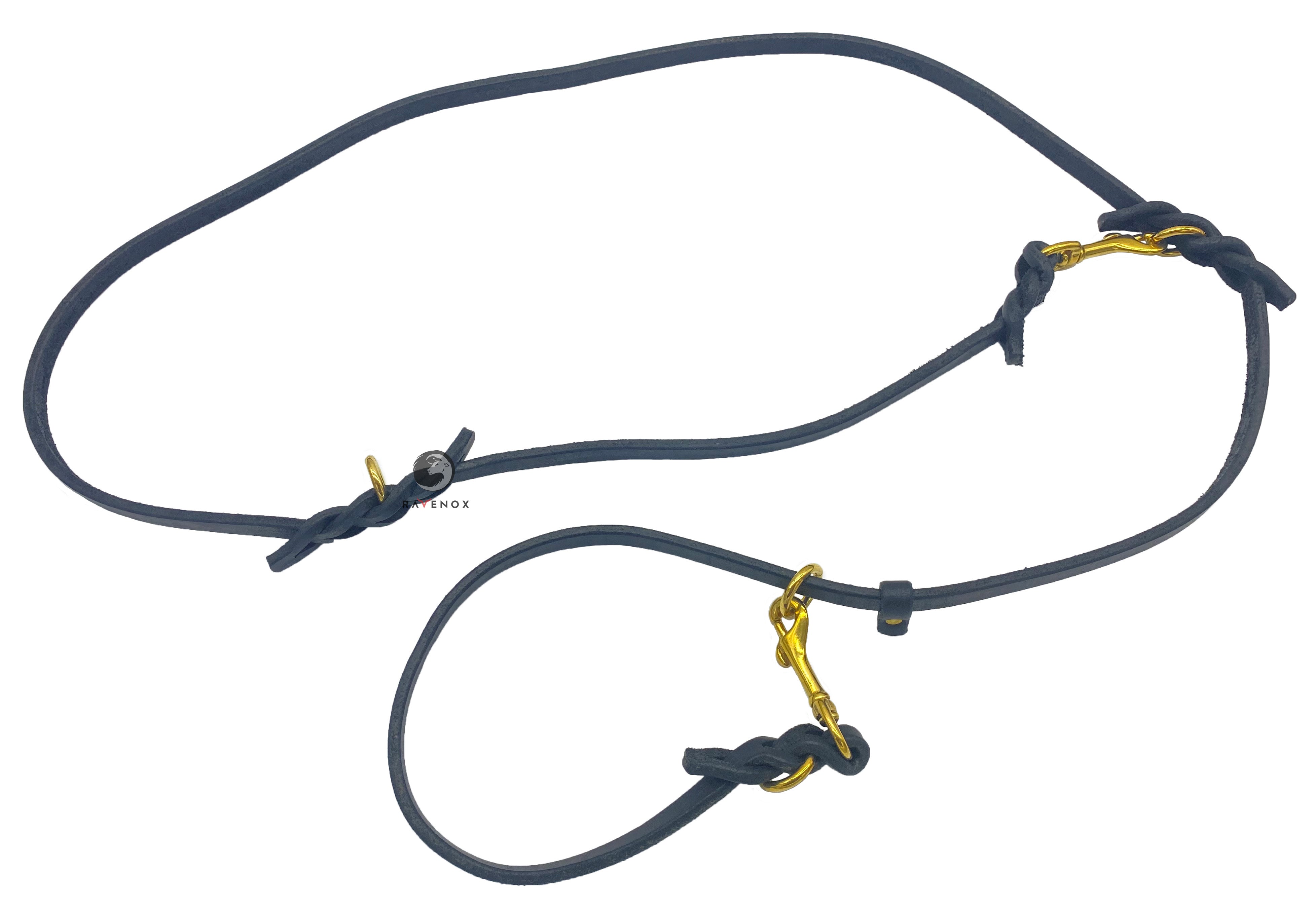 Image featuring the versatile Black Ravenox Multifunctional Leather Dog Leash with solid brass hardware, an all-in-one solution that functions as a long leash, traffic leash, hands-free leash, slip lead, short leash, long tether, control leash, and a two-dog leash, favored by veterinarians, obedience trainers, and police K-9 units for its superior control and multifunctionality. (7838529061101)